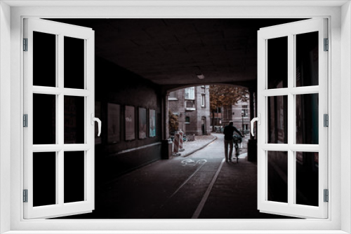 Fototapeta Naklejka Na Ścianę Okno 3D - Man walking down the street