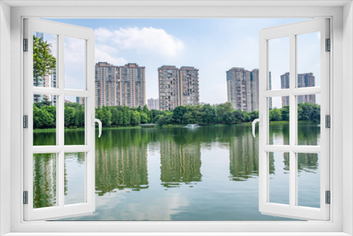 Fototapeta Naklejka Na Ścianę Okno 3D - Real estate real estate on the lakeside of Foshan Asian Art Park, Guangdong, China