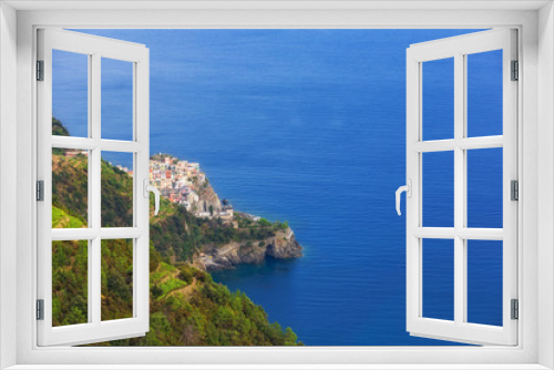 Fototapeta Naklejka Na Ścianę Okno 3D - Seacoast with deep blue sea and village with colorful houses on the slope in Cinque Terre, the Liguria region