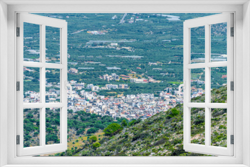 Fototapeta Naklejka Na Ścianę Okno 3D - Top view from the mountains to the village of Malia, roads and the nearby villages of the field and the Aegean Sea. Crete, Greece