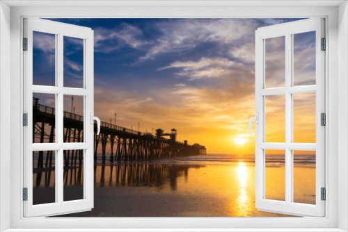Fototapeta Naklejka Na Ścianę Okno 3D - Beautiful sunset sky over the beach and ocean with wooden Oceanside pier - California, USA.