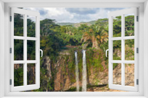Fototapeta Naklejka Na Ścianę Okno 3D - A waterfall at Chamerai, high up in the mountains of Mauritius near the Seven Coloured Earths Tourist Attraction