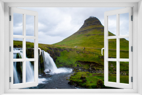 Fototapeta Naklejka Na Ścianę Okno 3D - Scenic panorama view of long exposure falling water in front of Kirkjufell volcano mountain, the most iconic travel destination location in Iceland. Summer time.