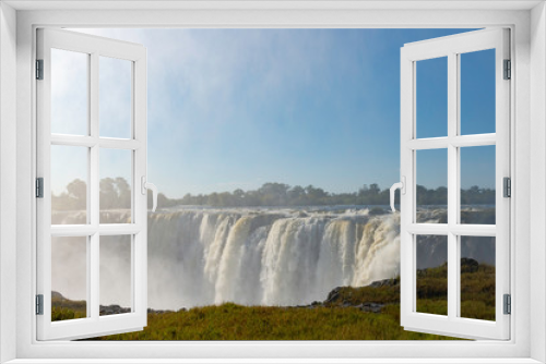 Fototapeta Naklejka Na Ścianę Okno 3D - picture of the Victoria Falls and a rainbow while beautiful sunlight
