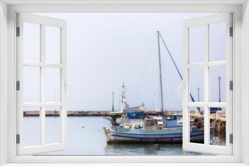 Fishing boats in small harbor , Halkidiki Greece