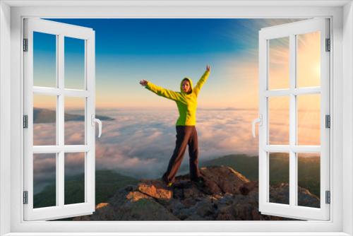 Fototapeta Naklejka Na Ścianę Okno 3D - A woman on top mountain, summer cloudscape