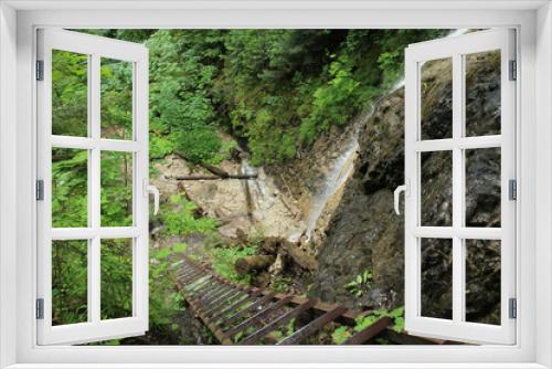 Fototapeta Naklejka Na Ścianę Okno 3D - Dangerous trail through a waterfall with steel ladders in the Slovak Paradise National Park, Slovaki