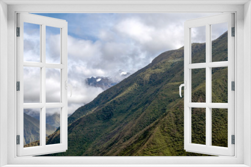 Fototapeta Naklejka Na Ścianę Okno 3D - Morning landscape with Peruvian Andes mountains peaks covered with clouds at sunrise