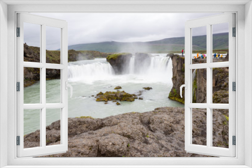 Fototapeta Naklejka Na Ścianę Okno 3D - Iceland landscape scenic view of Godafoss waterfall against cloudy sky. It is one of the famous tourist attractions. It is a spectacular Icelandic waterfall on the North of island