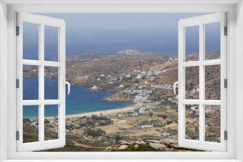 Fototapeta Naklejka Na Ścianę Okno 3D - Greece, the holiday island of Ios. A view of Mylopotos beach from the surrounding mountains on a summers day