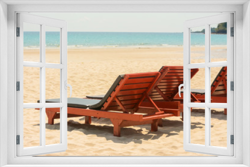 Fototapeta Naklejka Na Ścianę Okno 3D - Wooden lounge chairs on beautiful tropical beaches.