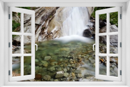 Fototapeta Naklejka Na Ścianę Okno 3D - A waterfall in the Italian Alps near the town of Macugnaga - July 2019.