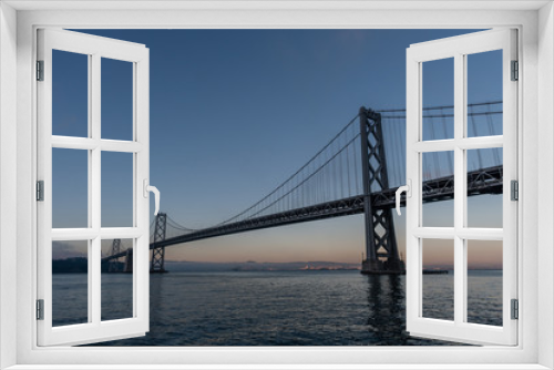 Fototapeta Naklejka Na Ścianę Okno 3D - Majestic Bay Bridge vista in San Francisco at dusk, Northern California