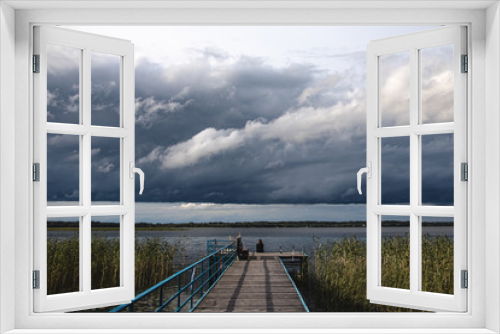 Fototapeta Naklejka Na Ścianę Okno 3D - wooden pier on the lake and storm clouds