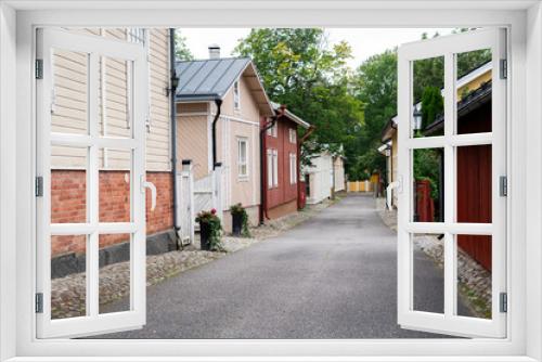 Fototapeta Naklejka Na Ścianę Okno 3D - Street of Scandinavian city with traditional wooden houses.