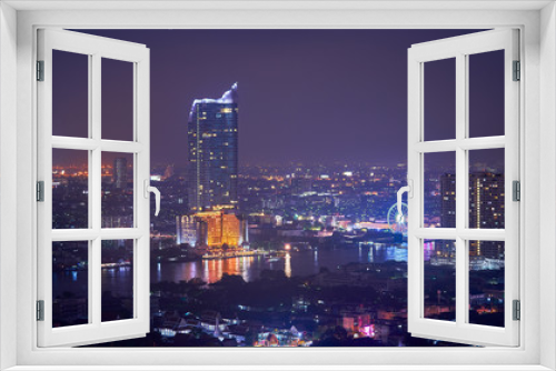Fototapeta Naklejka Na Ścianę Okno 3D - night cityscape along chao praya river of bangkok