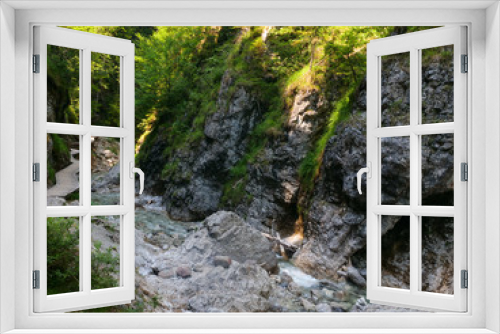 Fototapeta Naklejka Na Ścianę Okno 3D - Griessbach Gorge in Erpfendorf, Tyrol alps, Austria - wild stream running over stones, wild water