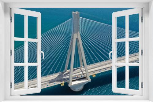 Fototapeta Naklejka Na Ścianę Okno 3D - Aerial drone photo of world famous cable suspension bridge of Rio - Antirio Harilaos Trikoupis, crossing Corinthian Gulf, mainland Greece to Peloponnese, Patras