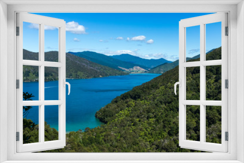 Fototapeta Naklejka Na Ścianę Okno 3D - Looking down the length of the beautiful and stunning Marlborough Sound and the surrounding hills at the top of the South Island, New Zealand on a sunny day.