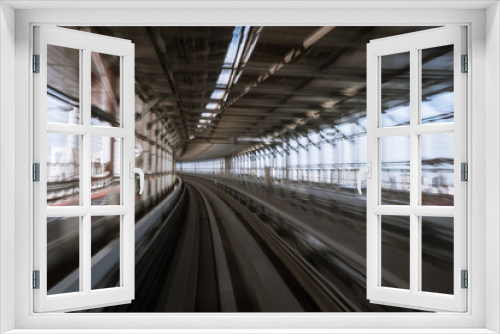 Fototapeta Naklejka Na Ścianę Okno 3D - motion-blurred view from a moving train running in tunnel