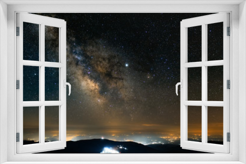 Fototapeta Naklejka Na Ścianę Okno 3D - Milky Way above the city lights