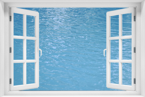 Fototapeta Naklejka Na Ścianę Okno 3D - Blue swimming pool edge with refection of water ripple