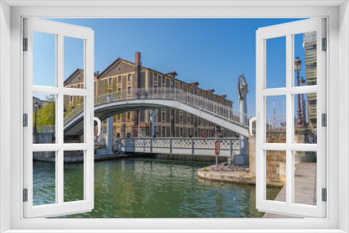 Fototapeta Naklejka Na Ścianę Okno 3D - Paris, France - 04 14 2019: Canal Lourcq. Bridge of Flanders
