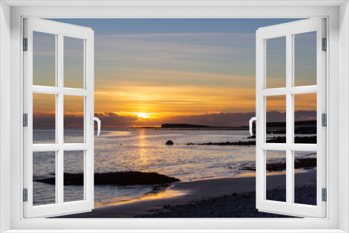 Fototapeta Naklejka Na Ścianę Okno 3D - A viewpoint over the water at Salthill, Galway, Ireland is a popular place to watch the sunset on the Irish coast
