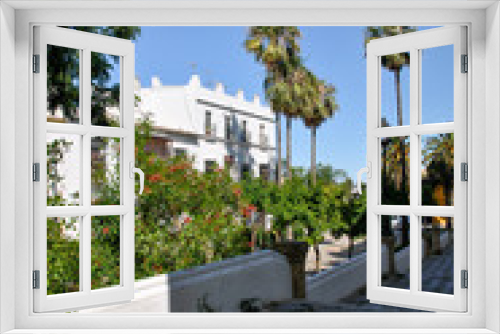 Fototapeta Naklejka Na Ścianę Okno 3D - Andalusia street view of Puerto de Santa Maria in Spain in summer with palm trees