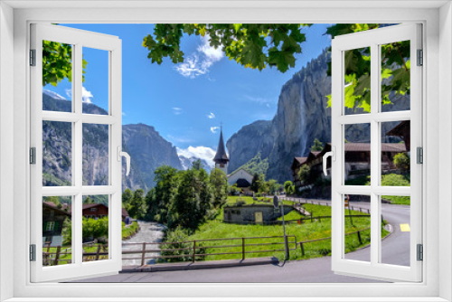Fototapeta Naklejka Na Ścianę Okno 3D - Summer view of waterfall in Lauterbrunnen village. Lauterbrunnen, Canton of Bern, Switzerland