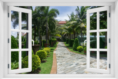 Fototapeta Naklejka Na Ścianę Okno 3D - garden with palm trees,Resort Hotel