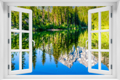 Fototapeta Naklejka Na Ścianę Okno 3D - Mirror Reflection of Mountain and Forest in Lake