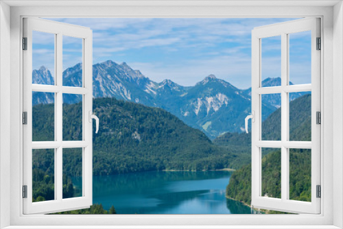 Fototapeta Naklejka Na Ścianę Okno 3D - Beautiful summer day in bavarian Alps with a view to Alpsee lake and Neuschwanstein castle Germany from hiking trail 