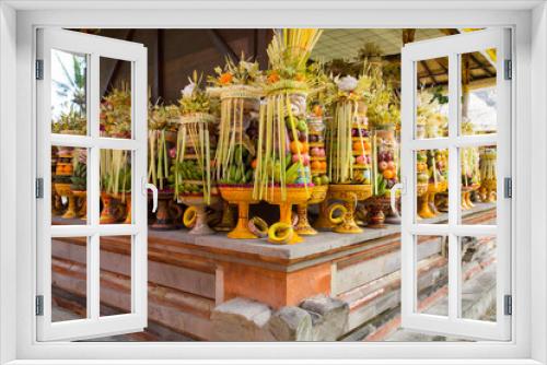 Fototapeta Naklejka Na Ścianę Okno 3D - Indonesia, Bali. During Hindu temple festivals at Pura Penataran Sasih in Bali offerings of food are made to the Gods in Indonesia.