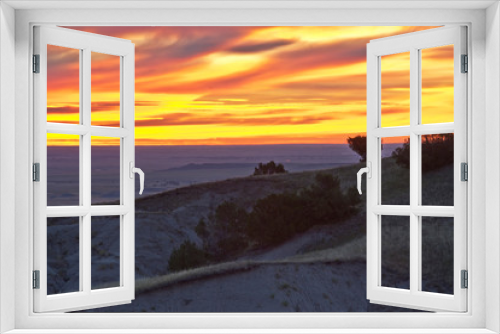 Fototapeta Naklejka Na Ścianę Okno 3D - Blazing sunrise, near Pinnacles Overlook, Badlands National Park, South Dakota, USA