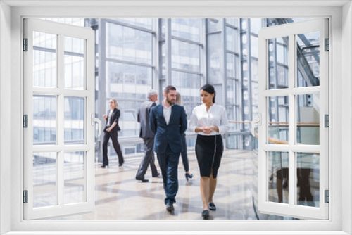 Business people walking in hall