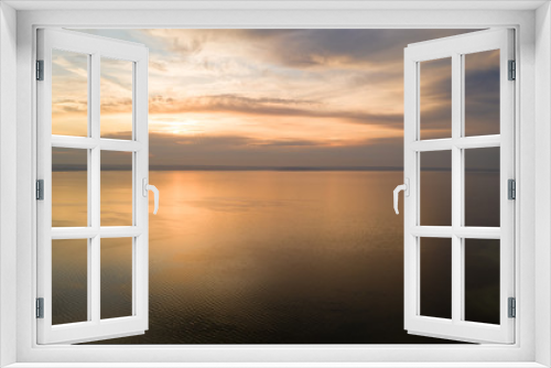 Fototapeta Naklejka Na Ścianę Okno 3D - Beautiful view of the sea and sunset. Aerial view from flying drone of a beautiful nature landscape with dramatic clouds sunset sky and views of the sea surface. Postcard view. Nature