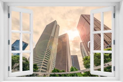 Fototapeta Naklejka Na Ścianę Okno 3D - 曇り空の新宿高層ビル群と新緑の木