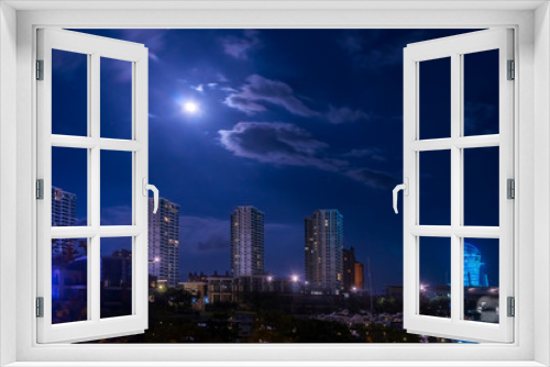Fototapeta Naklejka Na Ścianę Okno 3D - Night city view. Full moon. Sanya China