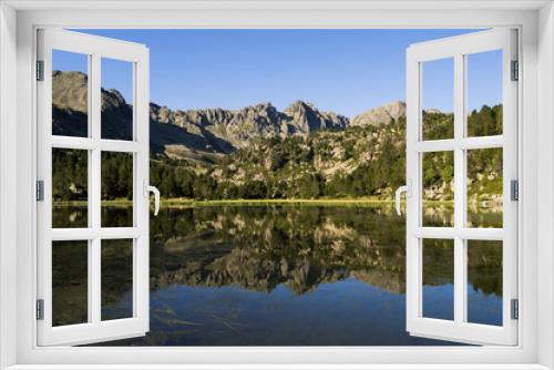 Fototapeta Naklejka Na Ścianę Okno 3D - Reflections in a high mountain lake.