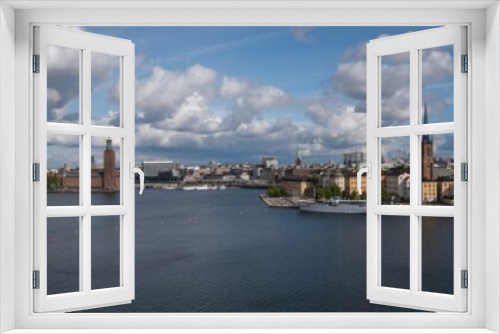 Fototapeta Naklejka Na Ścianę Okno 3D - Sunny view over Riddarholmen at the lake Mälaren in Stockholm a summer day	