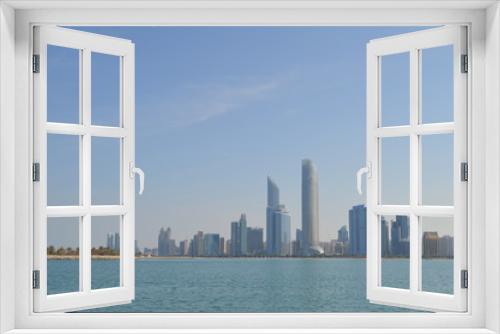 Fototapeta Naklejka Na Ścianę Okno 3D - Abu Dhabi city skyline along Corniche beach taken from a boat