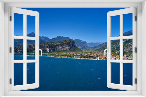 Fototapeta Naklejka Na Ścianę Okno 3D - Panorama of Lake Garda surrounded by mountains in Riva del Garda, Italy. Lake Garda Italy. Aerial view