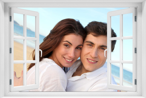 Portrait of lovely couple at the beach in summer