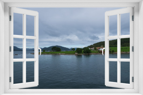 Fototapeta Naklejka Na Ścianę Okno 3D - Sunny Norwegian landscape. View of the route of the Lauvvik - Oanes ferry in Norway. July 2019