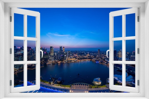 Fototapeta Naklejka Na Ścianę Okno 3D - Singapore Skyline at magic hour