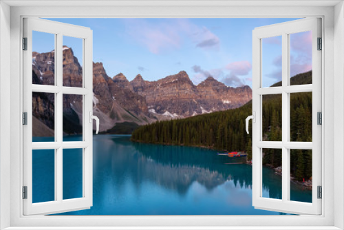 Fototapeta Naklejka Na Ścianę Okno 3D - Beautiful view of an Iconic Famous Place, Moraine Lake, during a vibrant summer sunrise. Located in Banff National Park, Alberta, Canada.