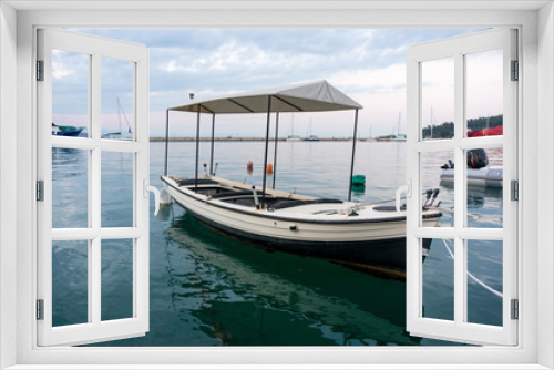 Fototapeta Naklejka Na Ścianę Okno 3D - Fishing boat in a small seaport