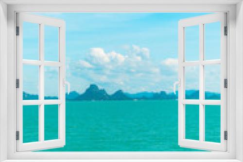 Fototapeta Naklejka Na Ścianę Okno 3D - Looking at the Island, blue water and sky.