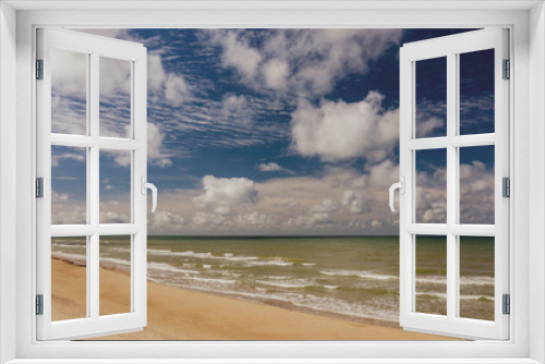 Fototapeta Naklejka Na Ścianę Okno 3D - View of the sea. Empty seaside. Blue sky. Cloudy weather.